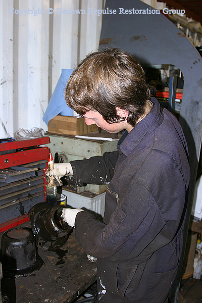Chris Bodell painting a brake cylinder cap